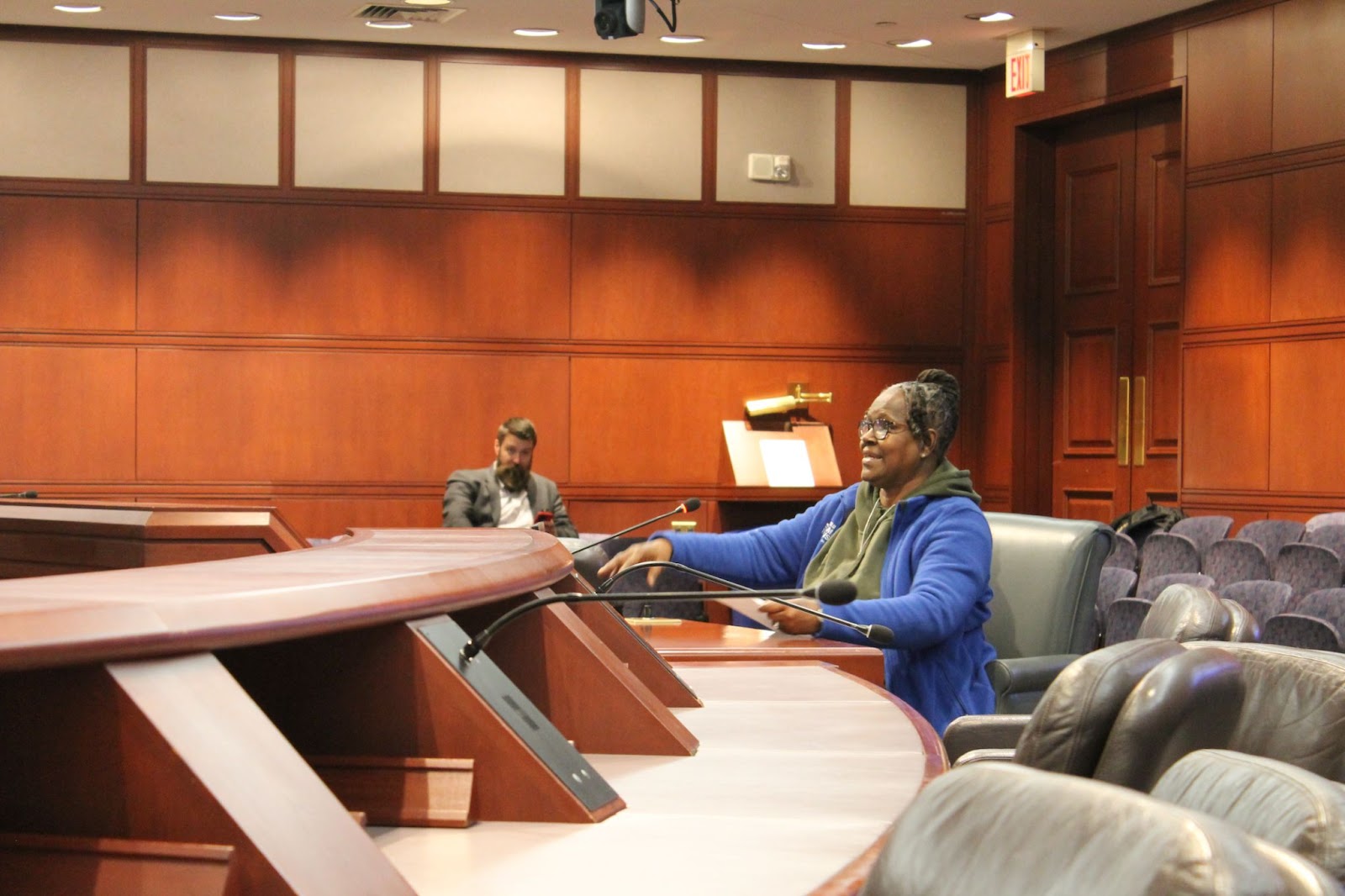Inside the housing committee room in the capitol building in Hartford, Connecticut, Terri Ricks, a female Smart Justice advocate testifies on behalf of equitable housing.
