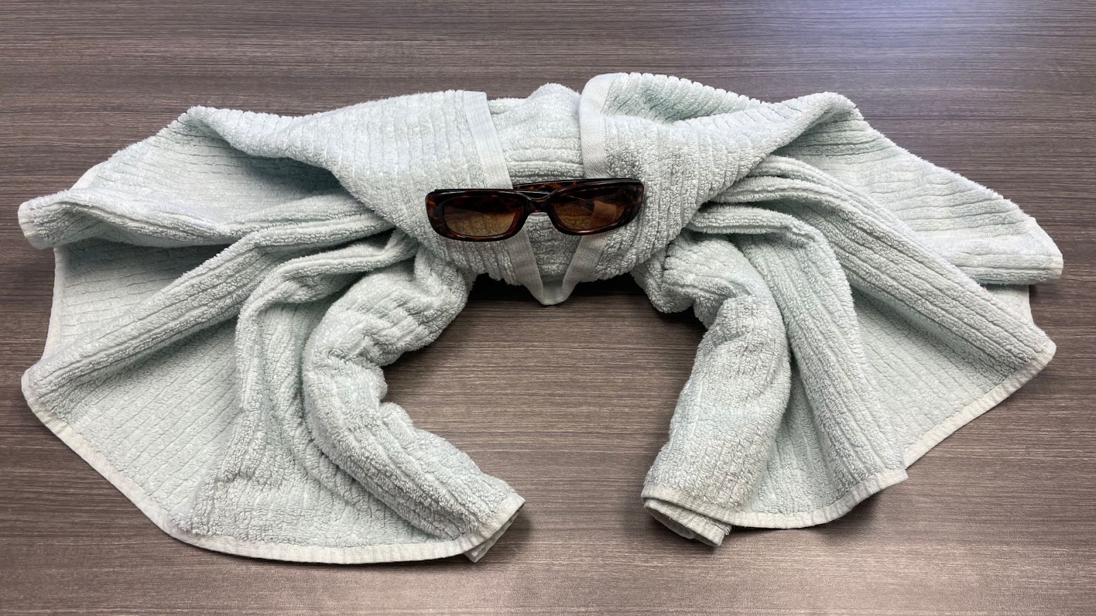 crab shaped animal folded towel with sunglasses for eyes