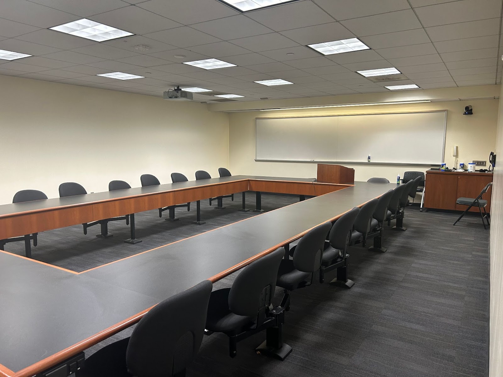 View of the front of the room: Projector, camera, hotline phone