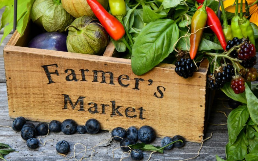 Farmers market produce in a crate labelled 'Farmer's Market'