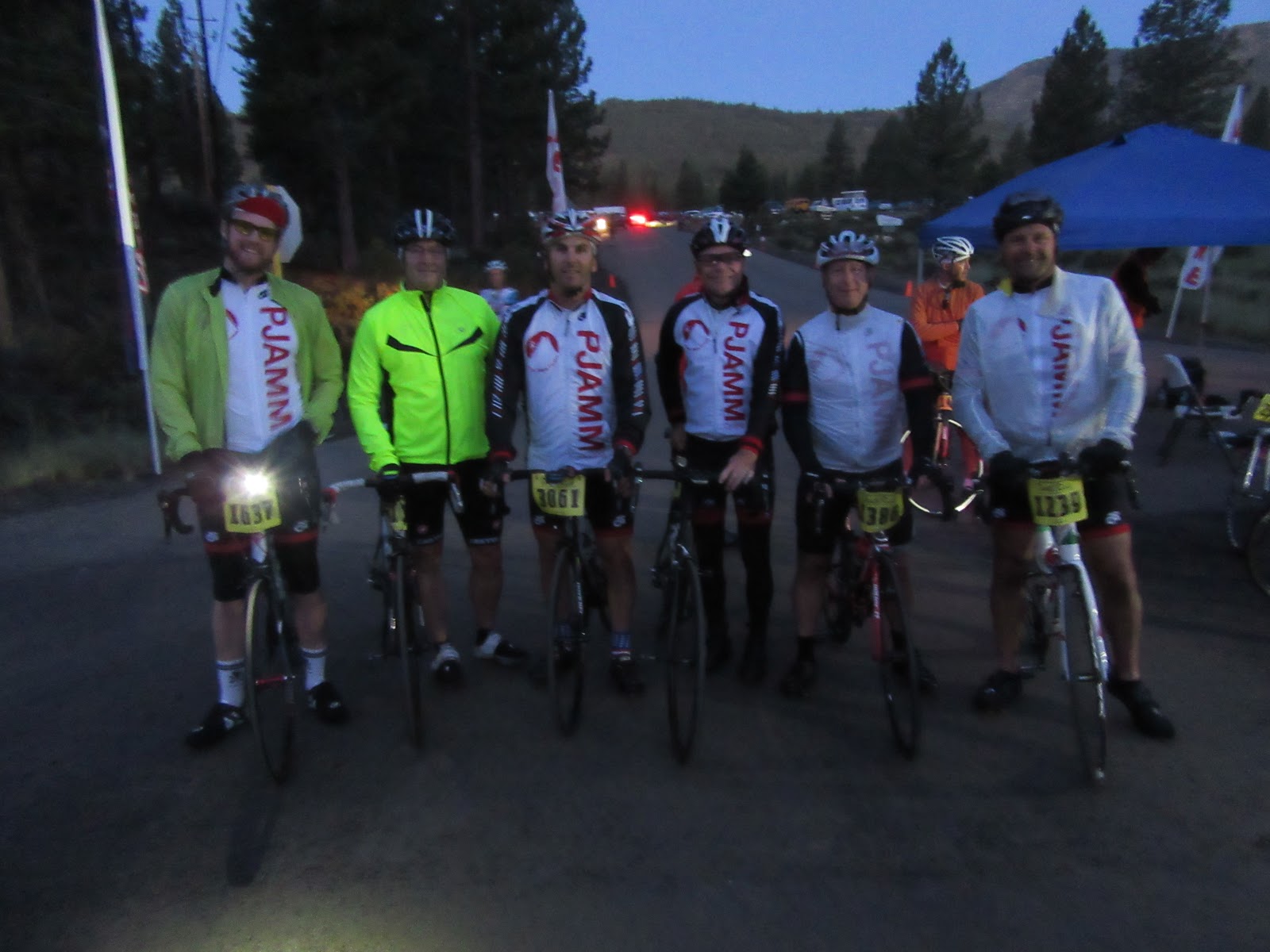 PJAMM Cyclists stand with their bikes before sunrise, at start of Death Ride