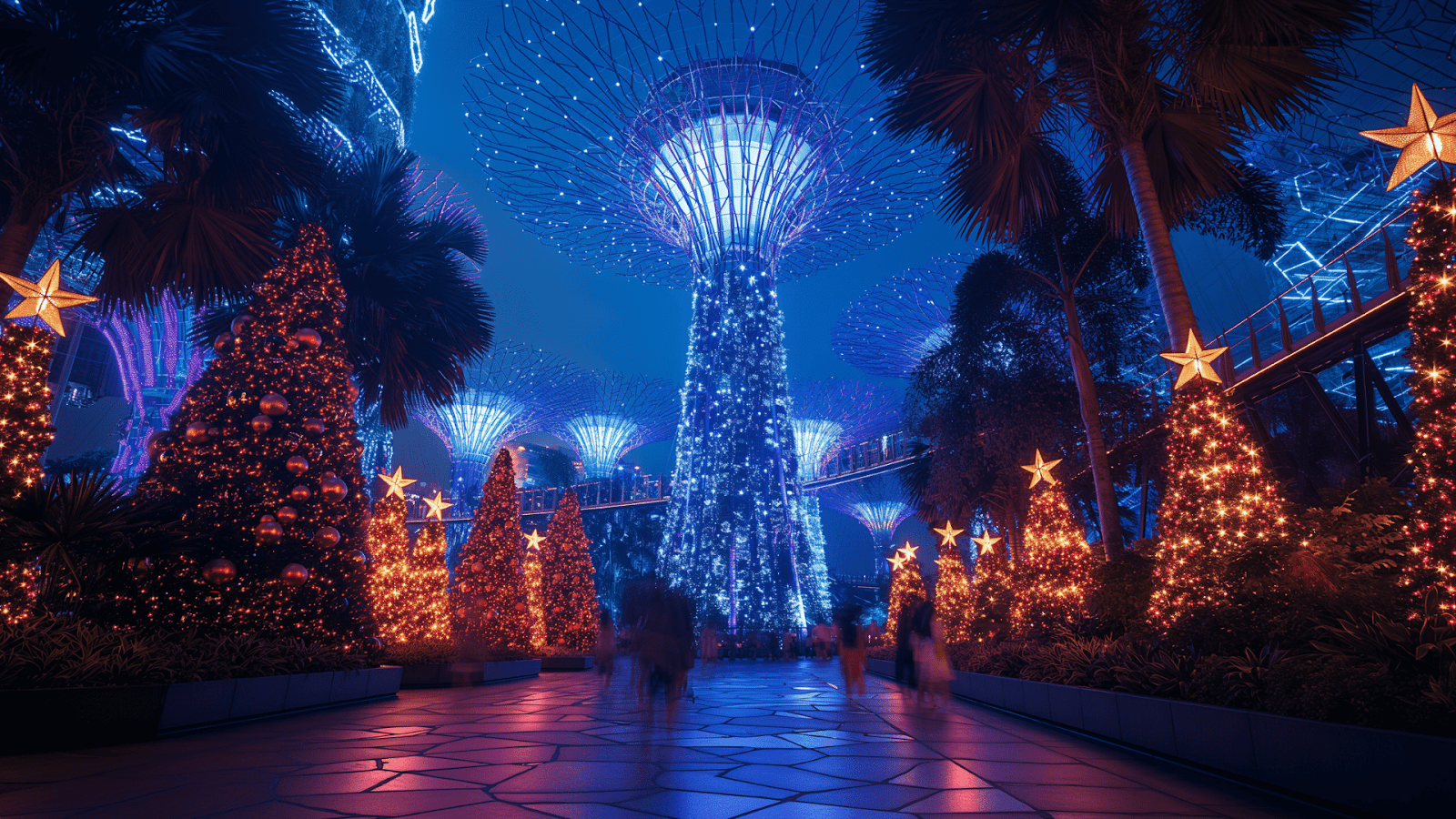 Christmas trees and decorations with star-shaped lights among futuristic tree-like structures at Gardens by the Bay, Singapore