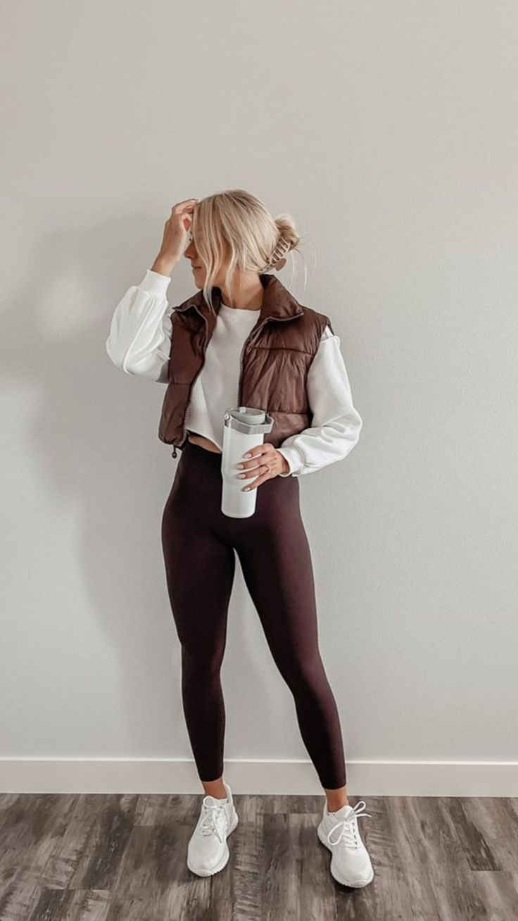 Picture of a lady rocking a crop top sweats with a bomber jackets and leggings to match
