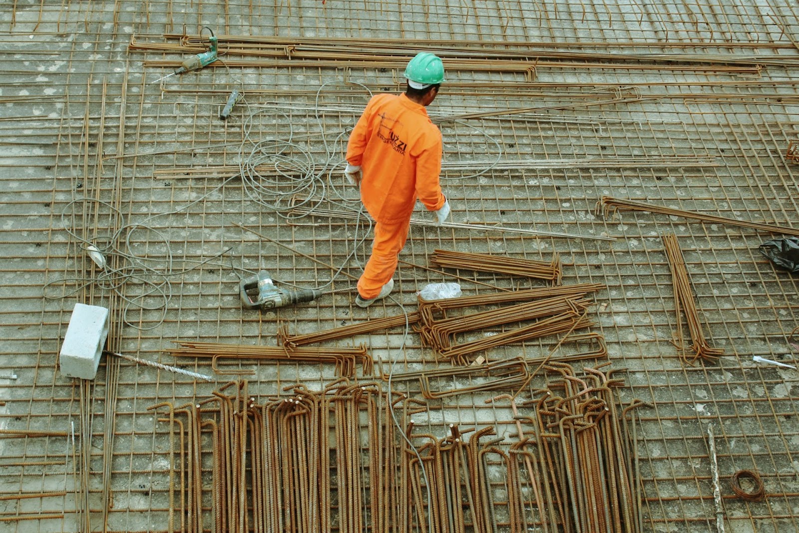 A construction worker wearing orange. 