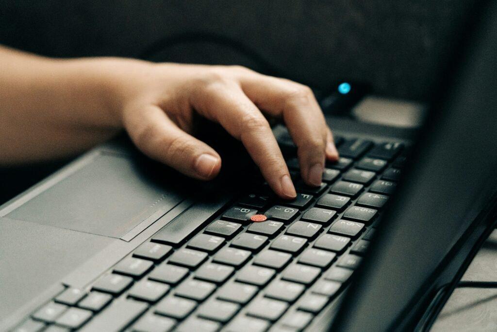 man typing on his laptop - How To Make Flash Cards