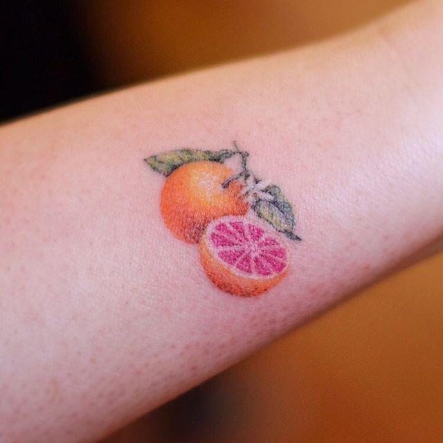 Grapefruit | Dainty Color Tattoo | Stick n poke tattoo, Poke tattoo, Fruit tattoo