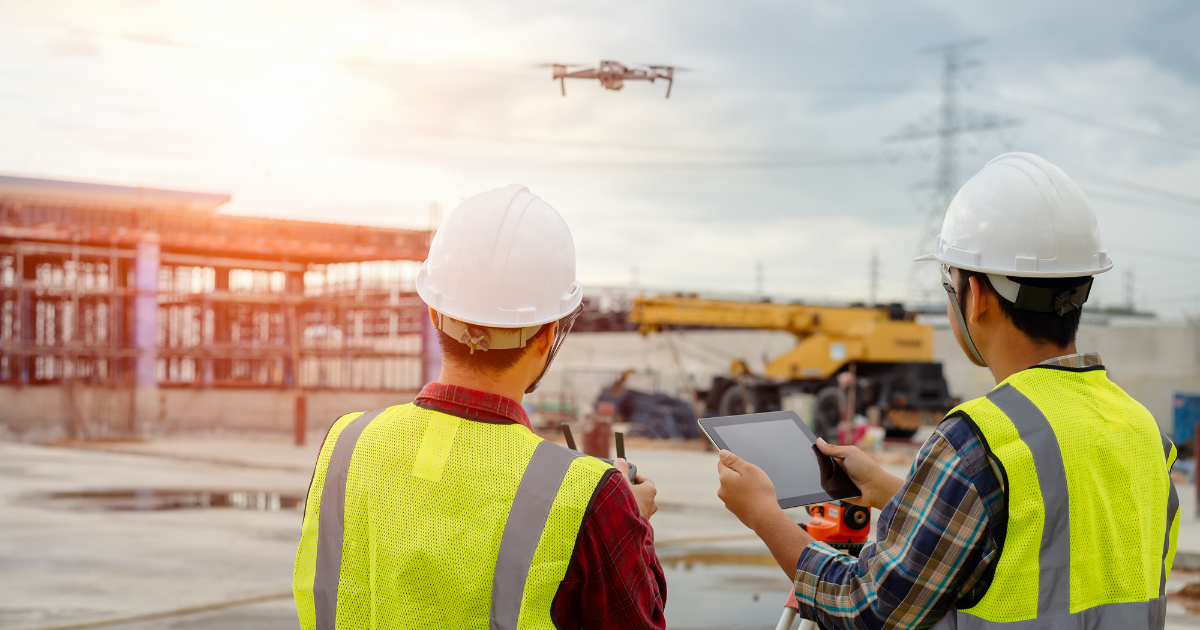 Civil engineers operating a drone, one of the emerging technologies in land surveying.