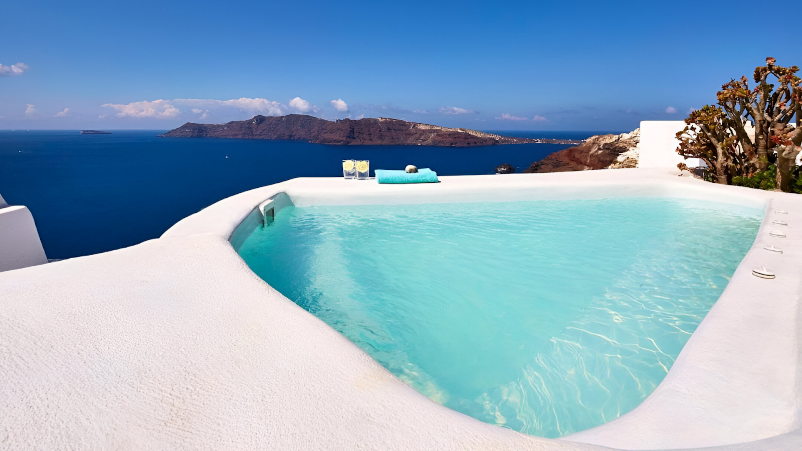 A pool overlooking the sea of a cave house in Santorini