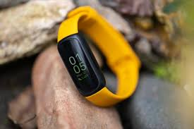Fitness Tracker (Pictured: A yellow one in a nature setting)