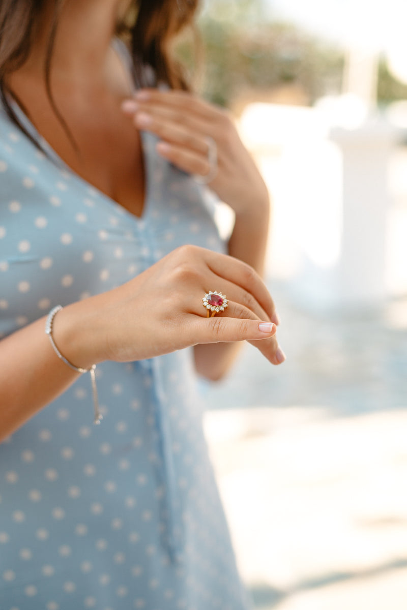 person holds their hand forward displaying a diamond ring - Image of Birthstones, An image of a pers