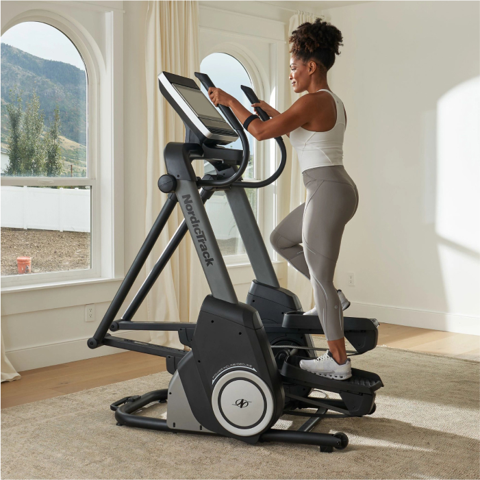 Woman Using Her NordicTrack Elliptical to Get a Good Workout In