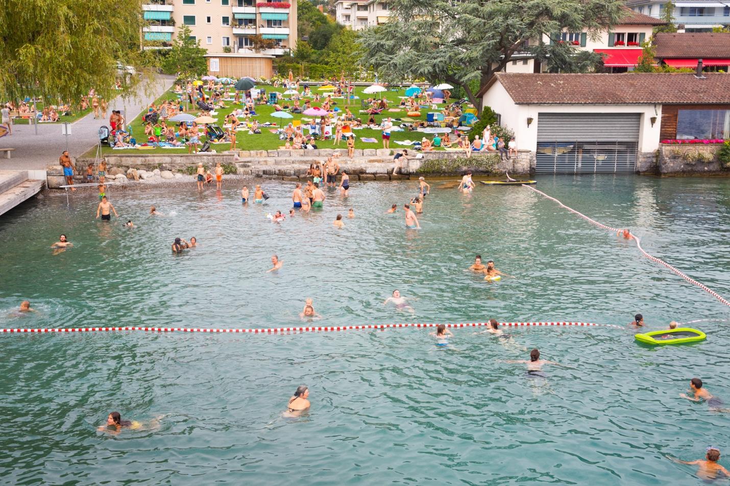 A group of people in a body of water

Description automatically generated