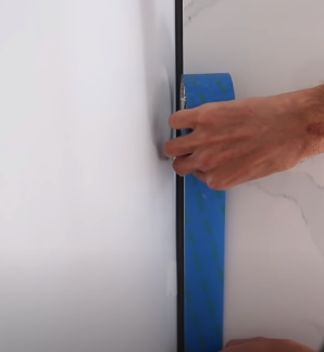 Covering the surface with painter’s tape - Caulking Large Gaps
