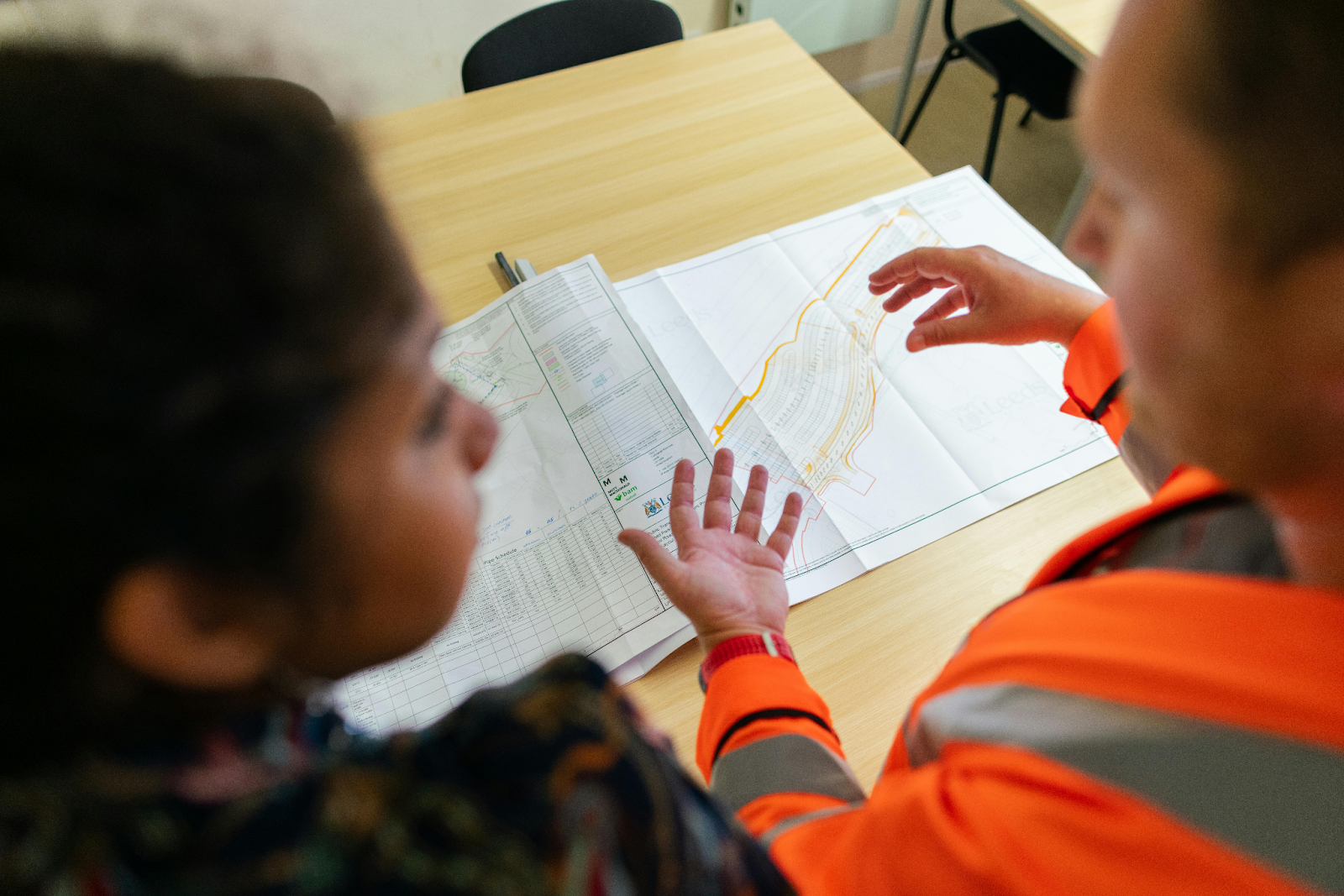 client and roofing contractor discussing their project