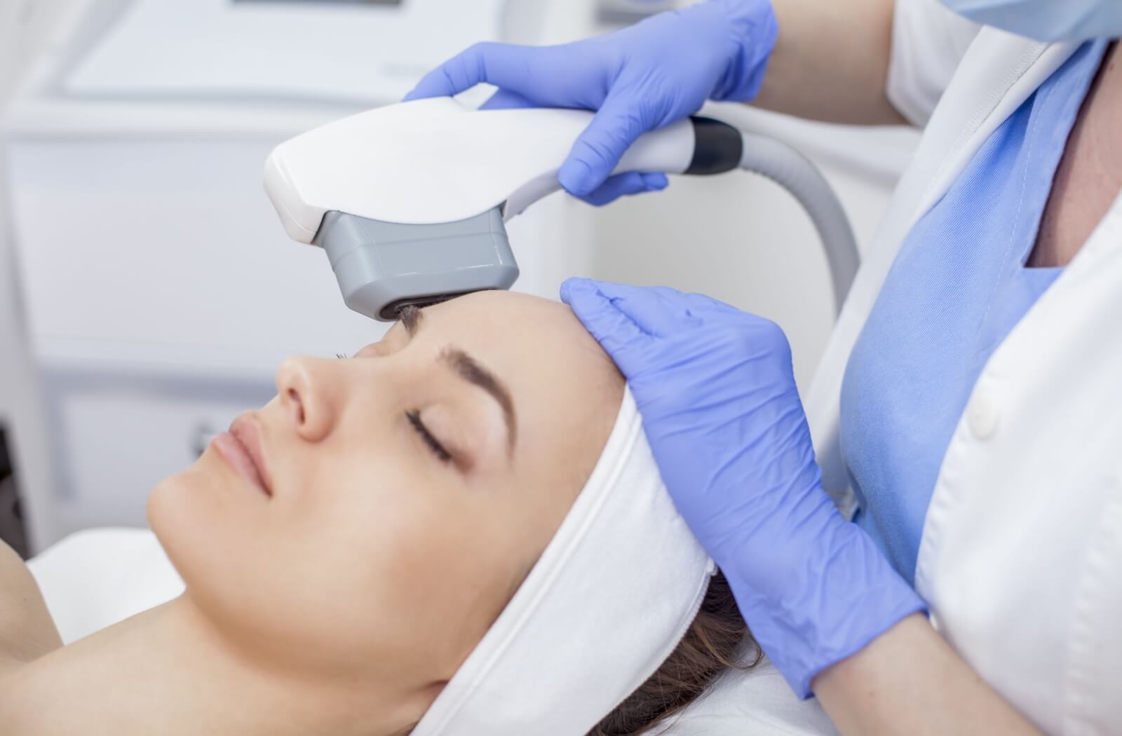 Close-up of a woman receiving an IPL Treatment from an optometrist using a specialized equipment