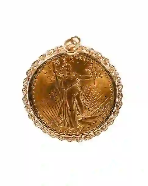 A gold coin with a picture of a person on itDescription automatically generated
