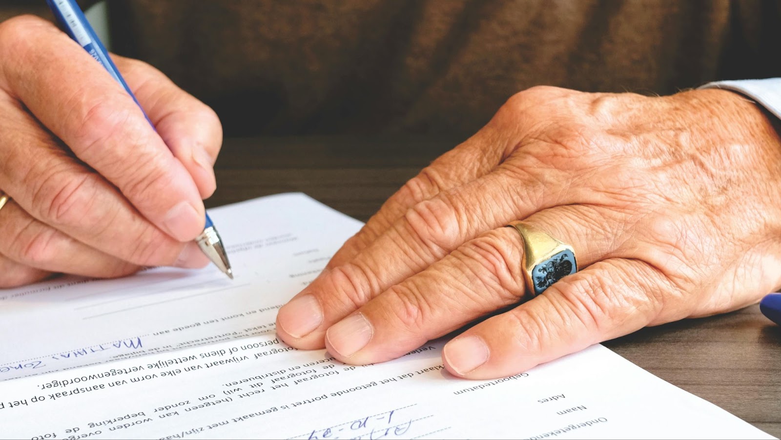 Senior citizen filling out estate planning paperwork