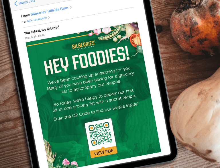 Bilberries’ Hillside Farm’s email newsletter displays a PDF QR Code on an Ipad next to fresh vegetables.