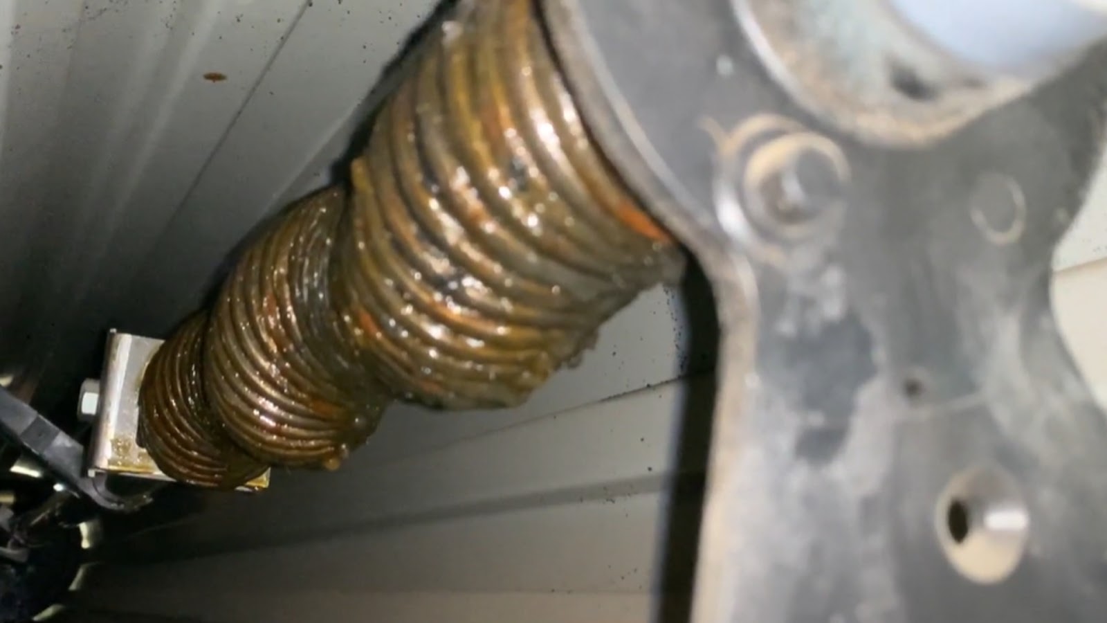A tightly wound garage roller door spring