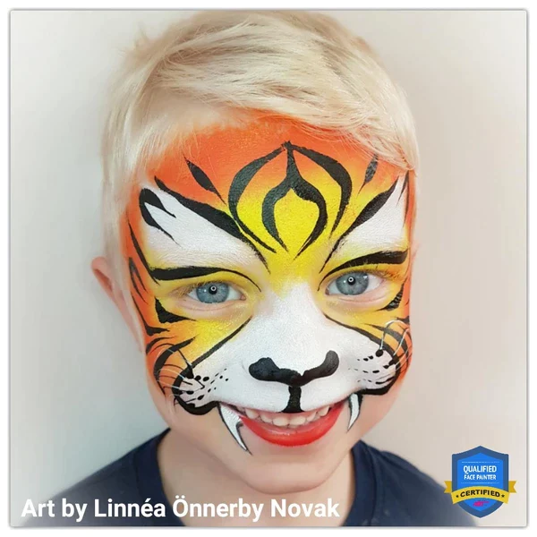 Picture of a young boy rocking a unique tiger face paint