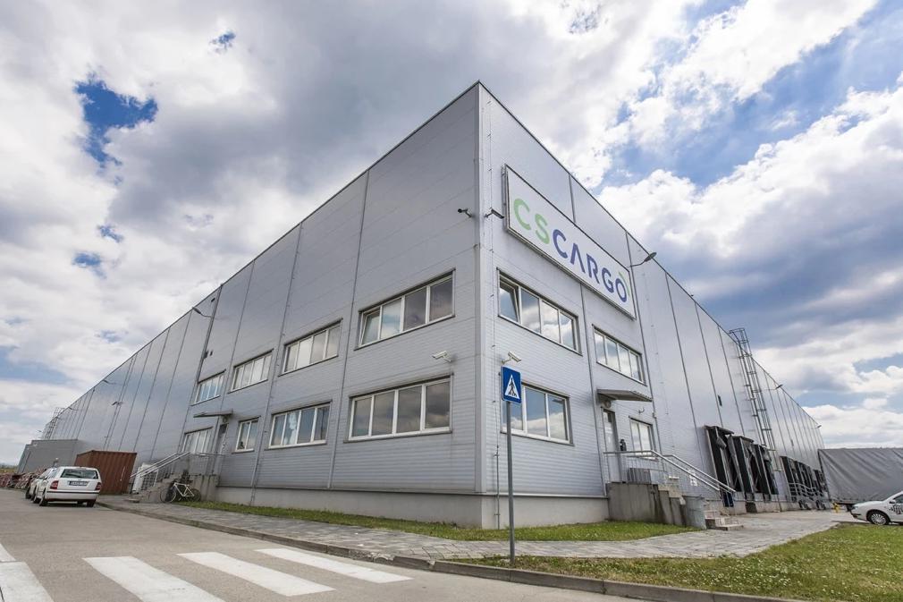 A large building with a sign on it
Description automatically generated
