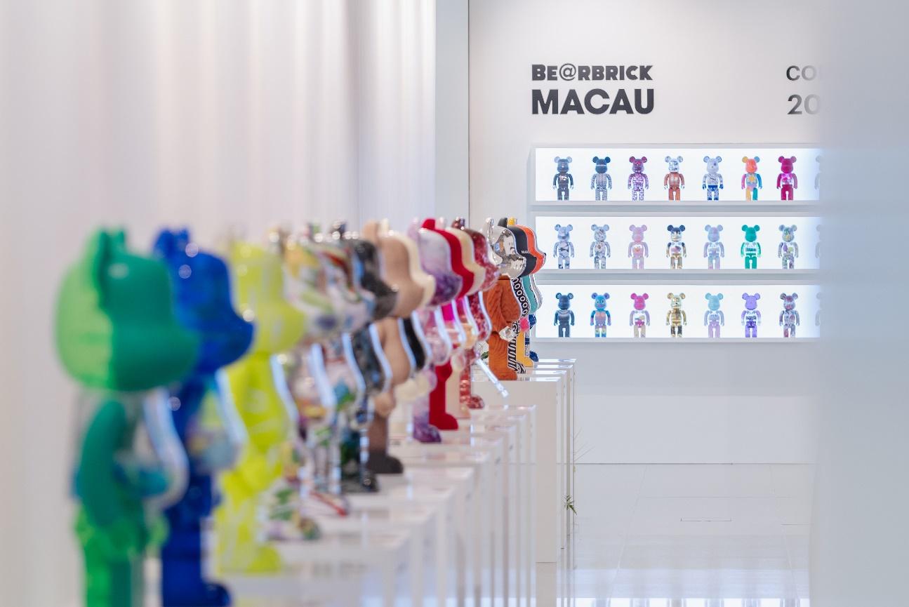 A row of colorful figurines

Description automatically generated