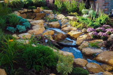 top water features to install for your outdoor living space bubbling brook in backyard custom built michigan