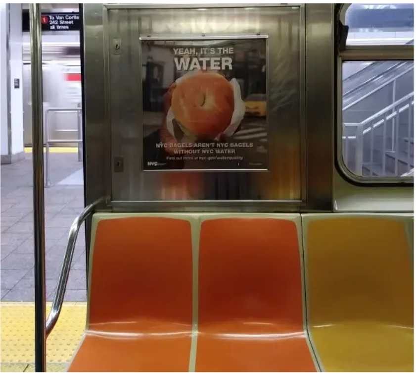 A poster on a subway

Description automatically generated