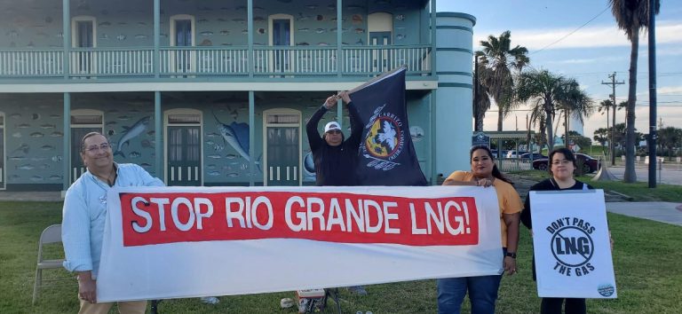 Protesters holding a banner that reads “Stop Rio Grande LNG”