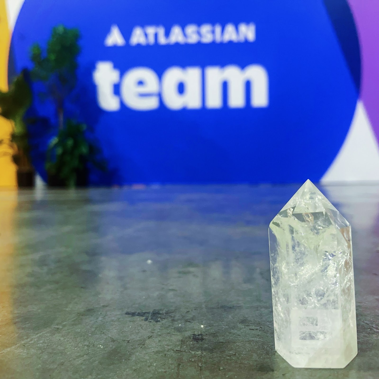 A Visor-branded crystal in front of the Atlassian Team expo hall sign