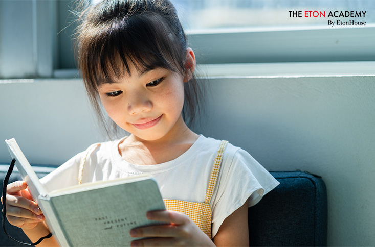 Image of a child reading a book