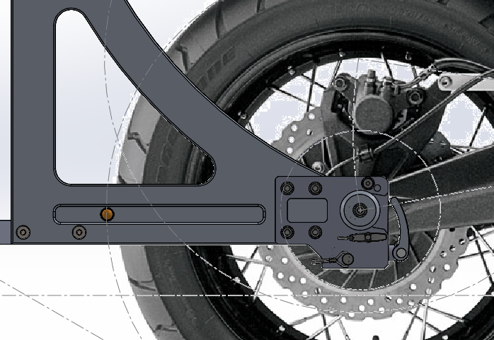 A side view of the ADV1 moto trailer attached to the wheel of a motorcyle.