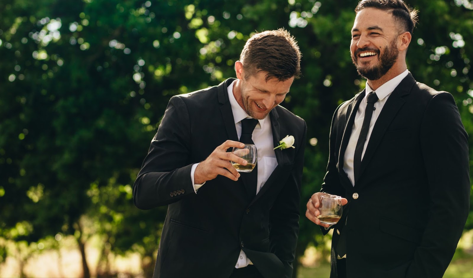 An image of a two groomsmen laughing at a Nashville wedding.