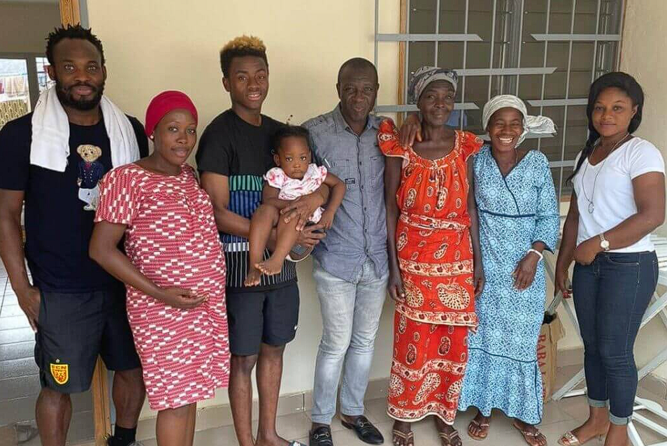 Simon Adingra with his family members (right) and Micheal Essien (left)