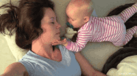 Gif of a Baby Playing With His Mommy