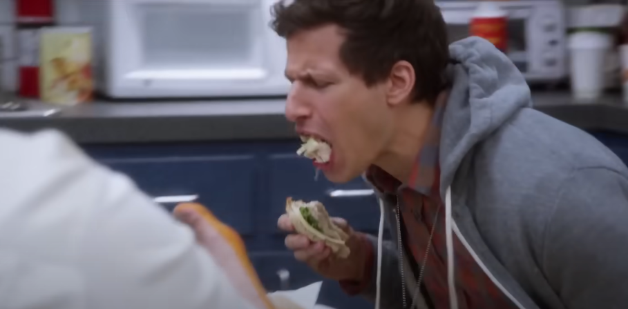 Jake regurgitating food in a scene from the sitcom Brooklyn 99