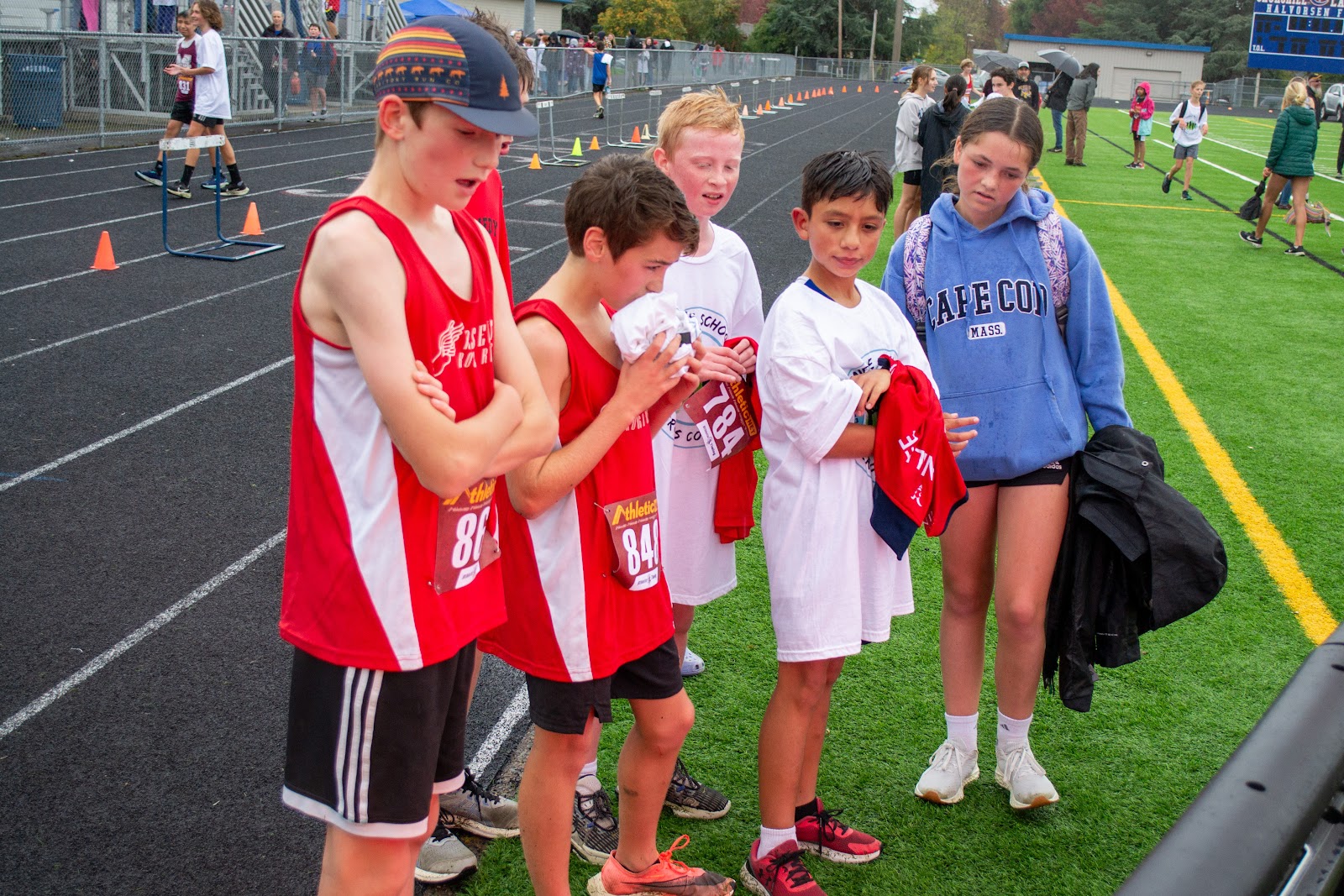 Runners watch scoreboard