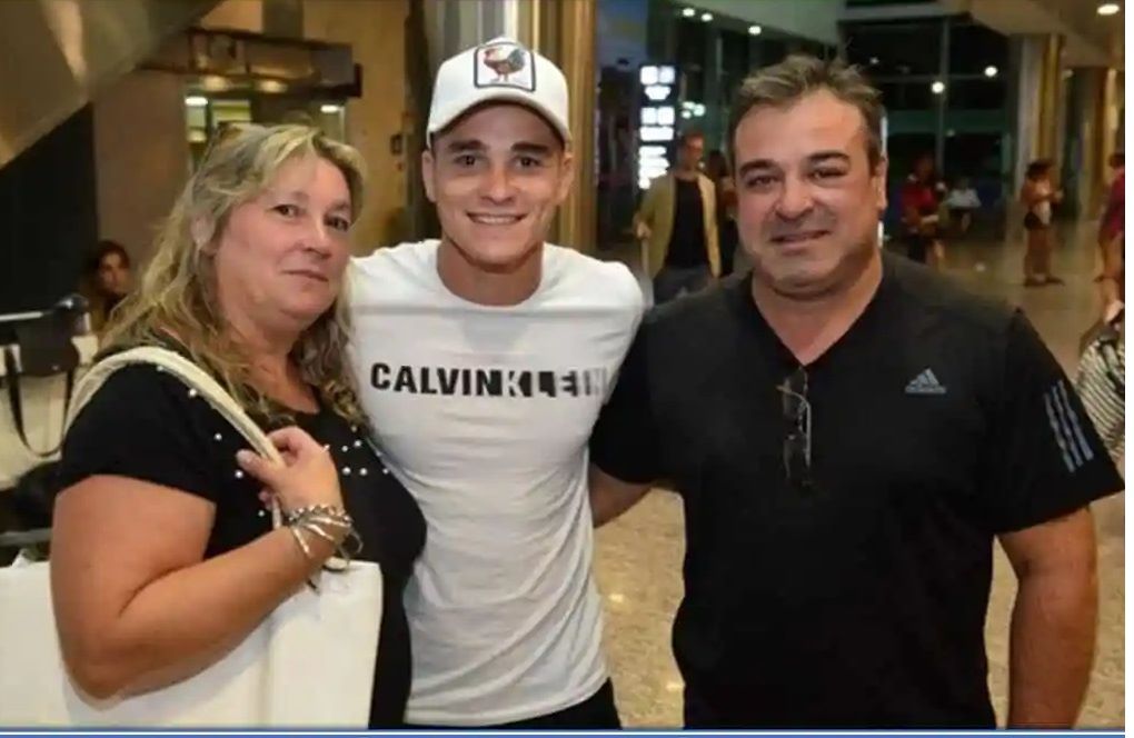 Julian Alvarez with his father and mother