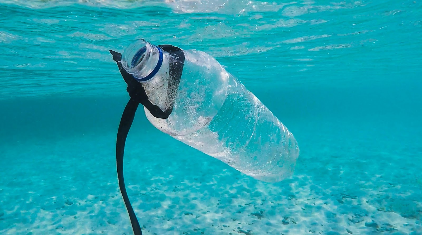 Plastic bottle in the ocean calls for the importance of recycled polyester