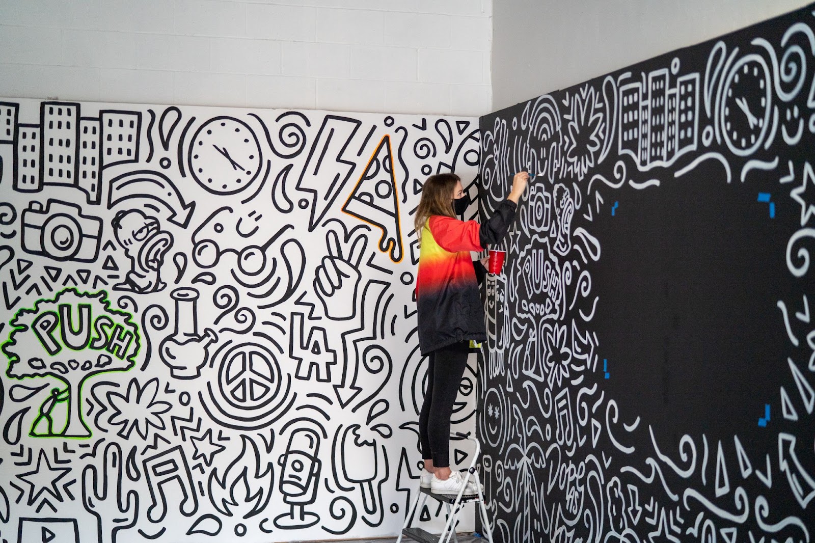 An artist paints mural inside home 