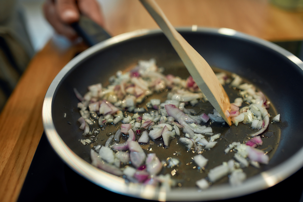 preparing onions for hyderabadi biryani