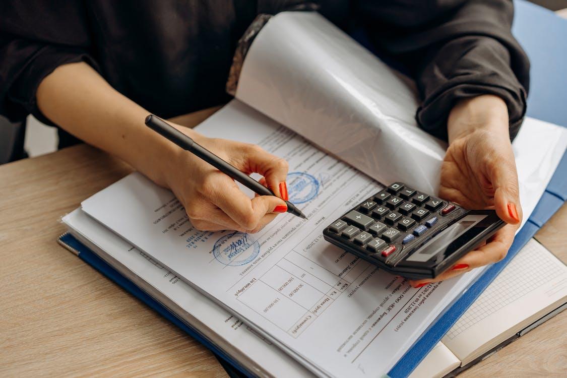 Free A Person Examining a Document Stock Photo