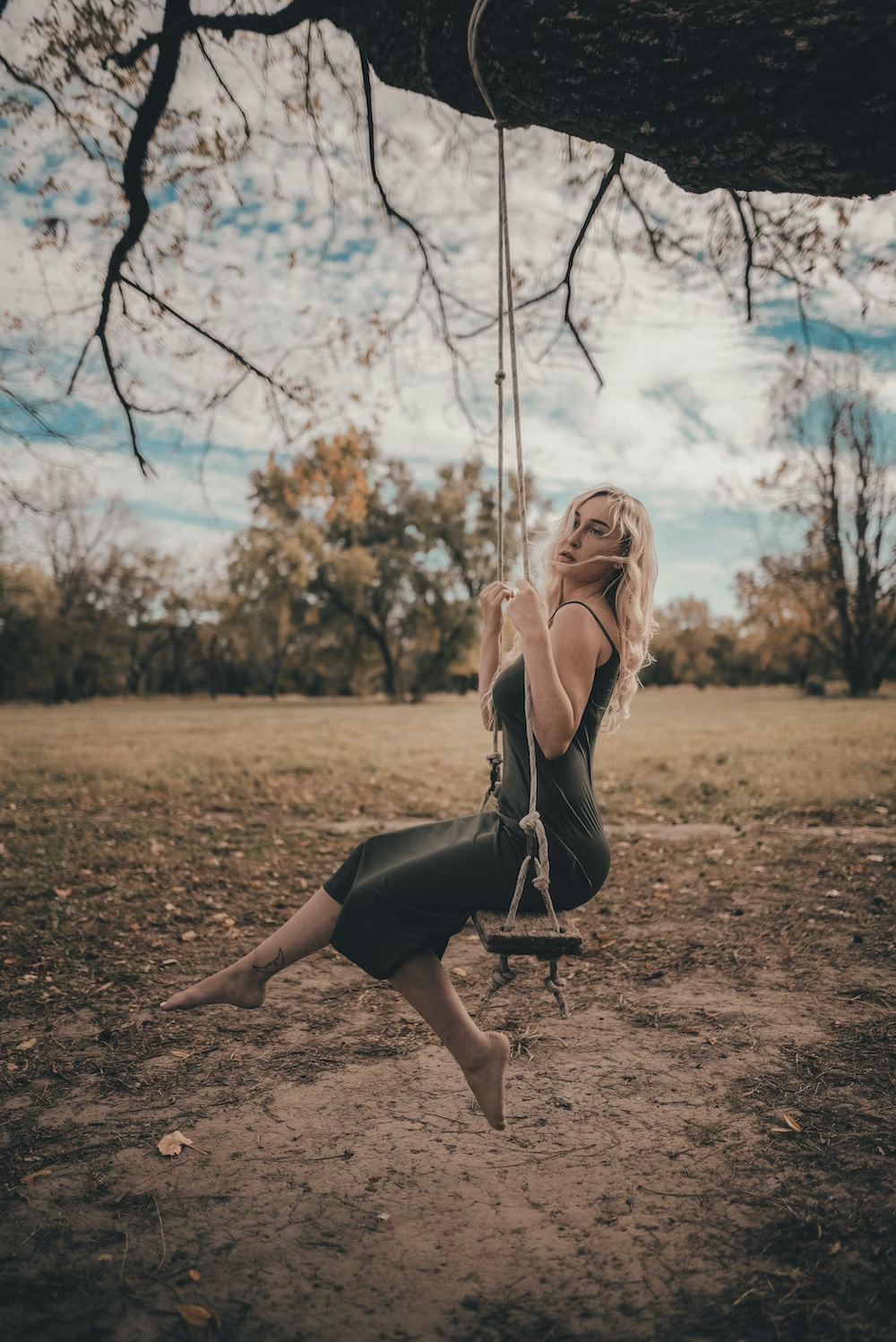 Woman on Swing In The Fall