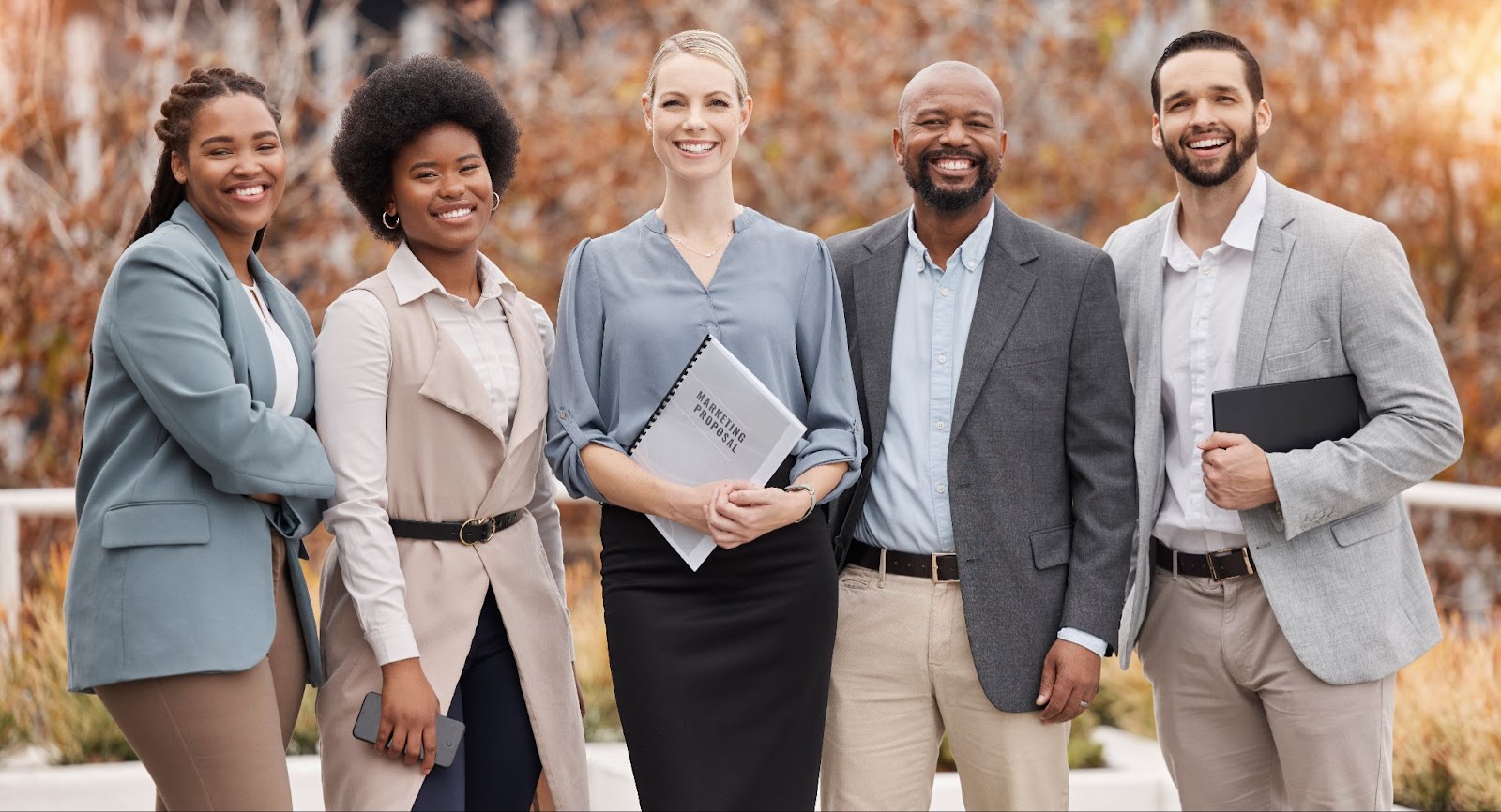 Portrait of a management services team showcasing diversity and leadership during a corporate development meeting.