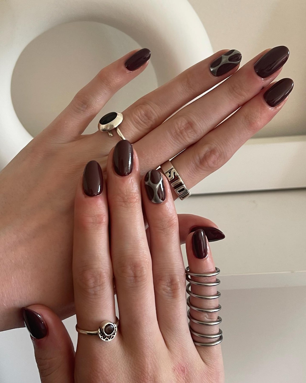 Silver Accents with deep Brown Nails