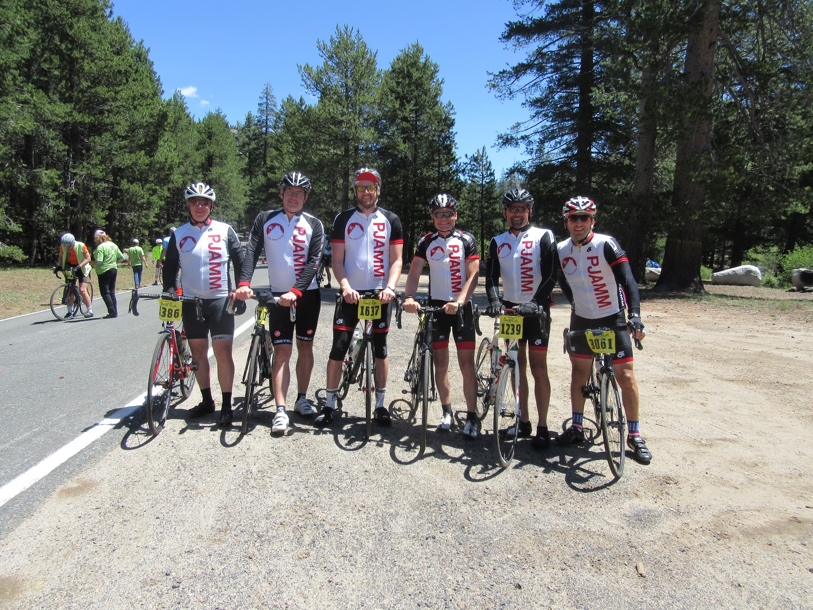 Six PJAMM Cyclists stand with bikes at the bottom of the Ebbets Pass West climb on the Death Ride