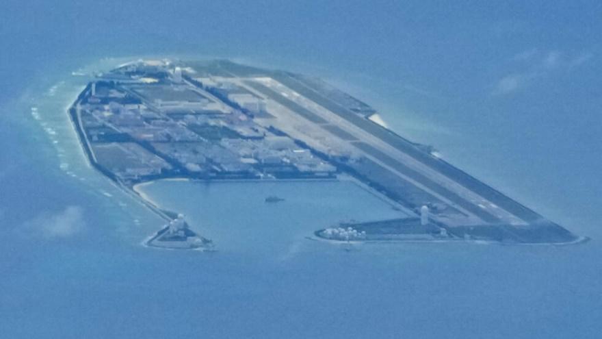 Chinese structures and buildings on the man-made Fiery Cross Reef at the disputed Spratlys group of islands in the South China Sea are seen on March 20, 2022. The Philippine government has summoned a