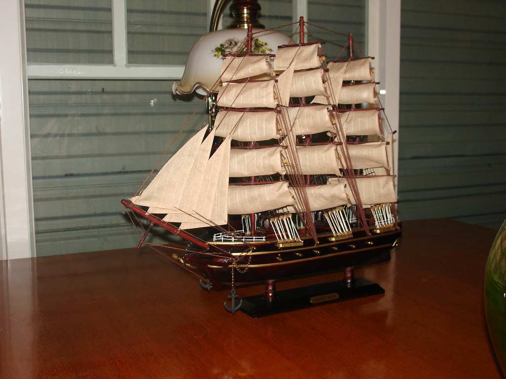 Heping Dadao Wine Store 001 - a model of a sail boat on a table