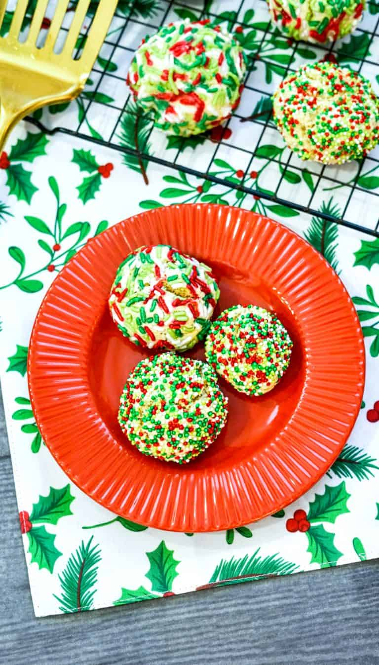 christmas sprinkle cookies on red plate
