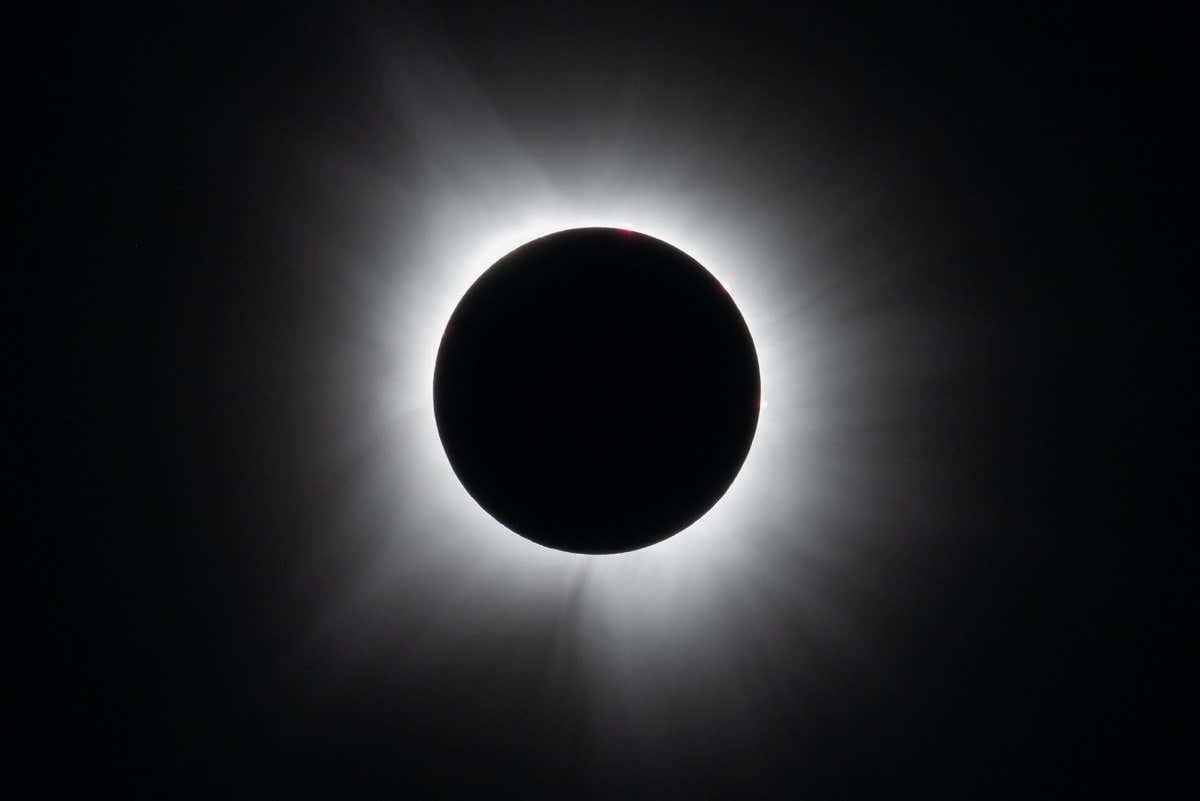 A solar eclipse with a bright light

Description automatically generated with medium confidence